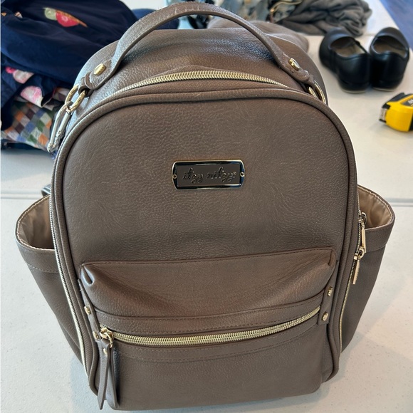 Itzy Ritzy Handbags - Itzy Ritzy Mini Plus™ Diaper Bag in tan